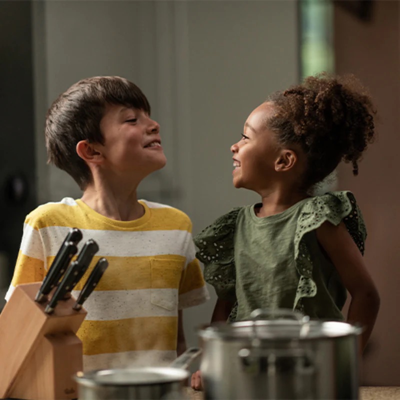Kids smiling in kitchen